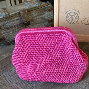 Sugar pink colored clutch bag